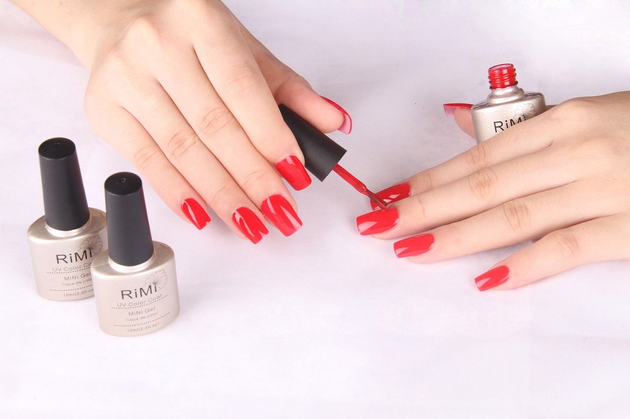 A technician examining nails and cuticles